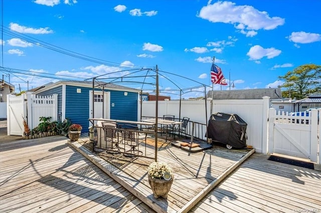 wooden deck featuring grilling area