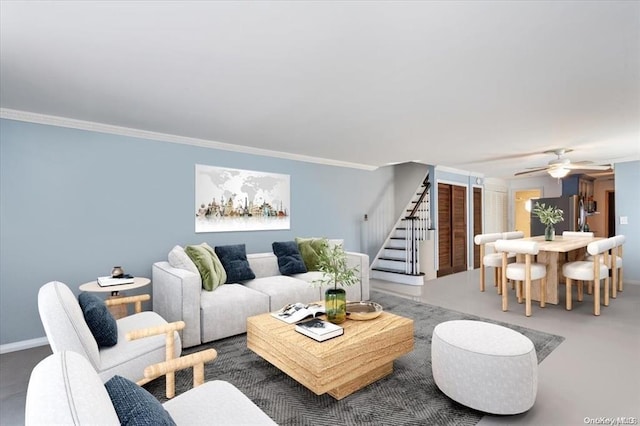 living room with crown molding and ceiling fan