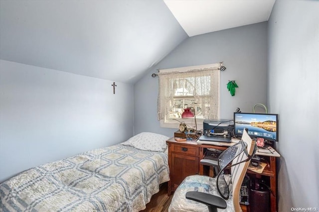 bedroom with lofted ceiling