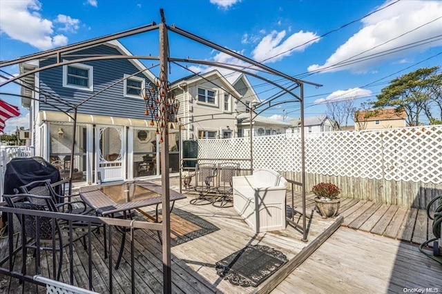 wooden deck with grilling area