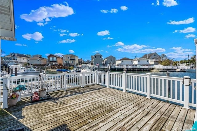 wooden deck featuring a water view