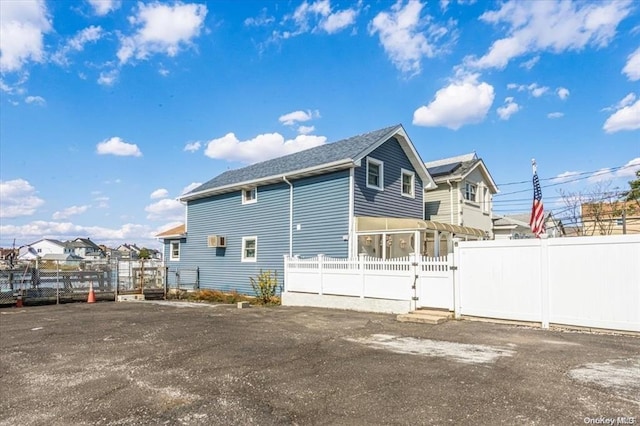 view of side of property with a sunroom