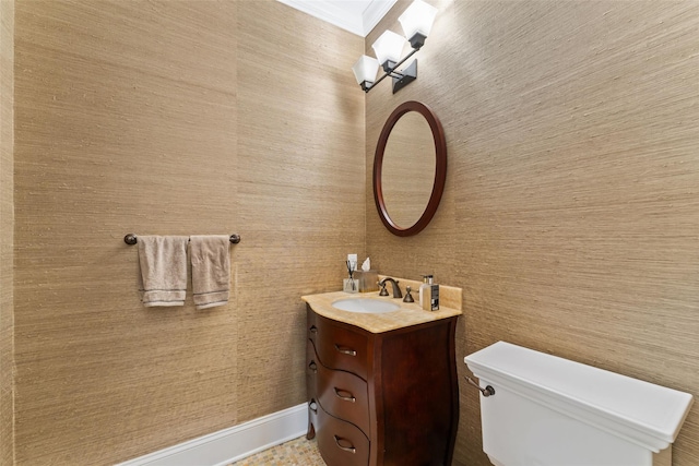 bathroom featuring toilet and vanity