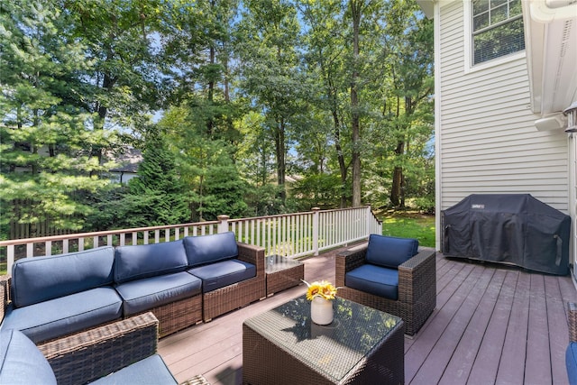 wooden deck featuring area for grilling and an outdoor hangout area