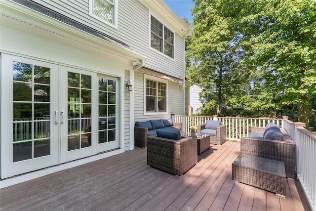 wooden terrace featuring an outdoor hangout area and french doors