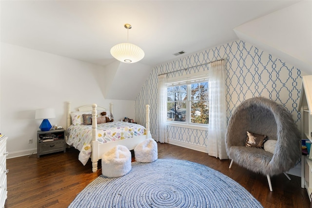 bedroom featuring dark wood-type flooring and lofted ceiling