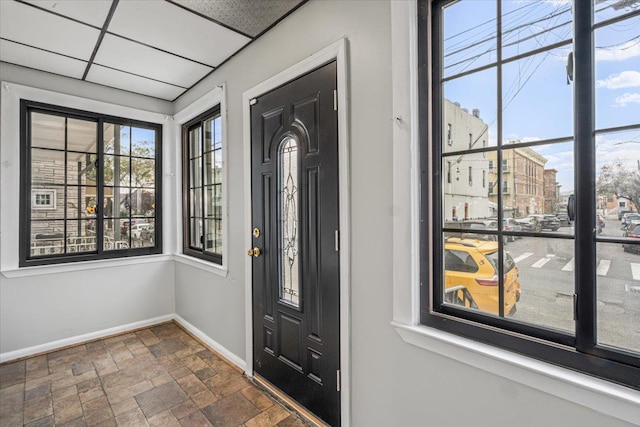 entrance foyer with a drop ceiling