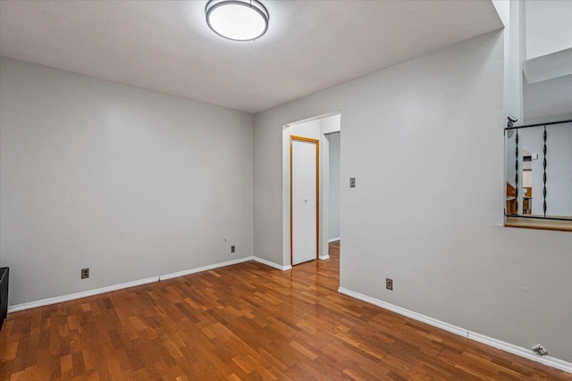 empty room with hardwood / wood-style flooring