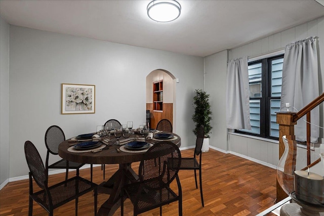 dining area with dark hardwood / wood-style floors