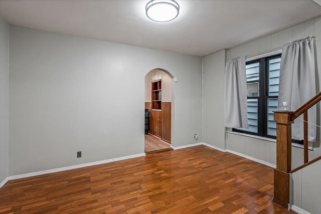 unfurnished room featuring wood-type flooring