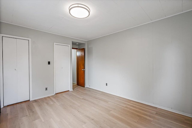 unfurnished bedroom featuring light wood-type flooring