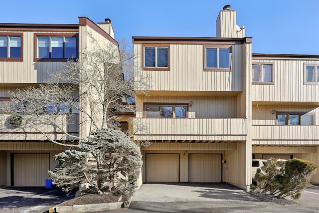 4 Dakota Ct, Suffern, NY 10901 - view of property featuring an attached garage and driveway