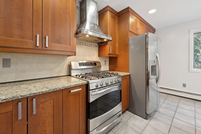 kitchen with backsplash, wall chimney exhaust hood, light stone countertops, light tile patterned floors, and stainless steel appliances