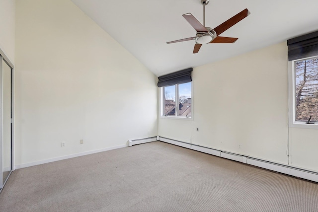 carpeted empty room with ceiling fan, high vaulted ceiling, and a baseboard heating unit