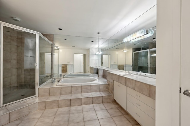 bathroom with vanity, tile patterned floors, and independent shower and bath