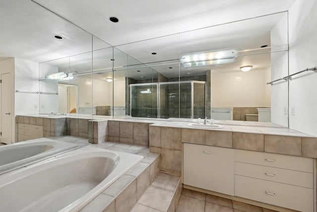 bathroom featuring tile patterned floors, vanity, and independent shower and bath