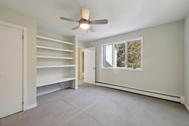 unfurnished bedroom featuring ceiling fan, light carpet, and a baseboard heating unit