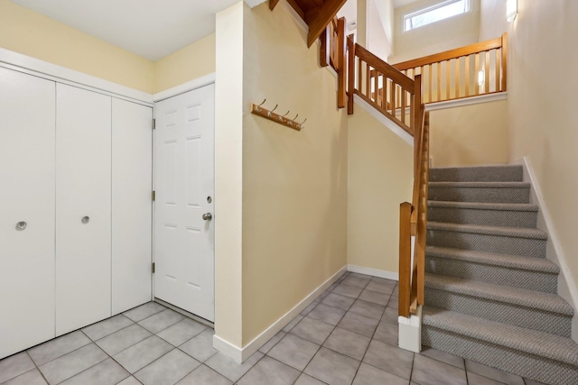 stairs with tile patterned flooring