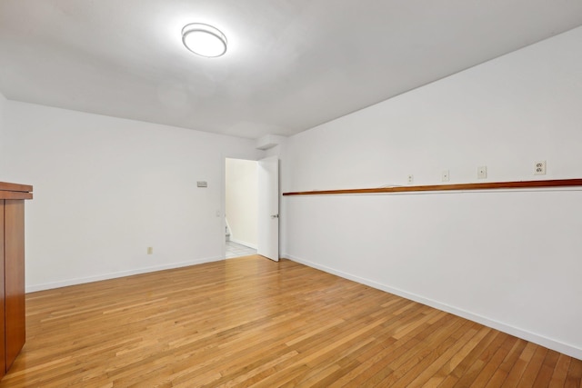 empty room with light hardwood / wood-style floors