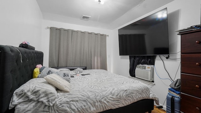 2413 Wilson Ave, Bronx, NY 10469 - bedroom with cooling unit and light wood-type flooring