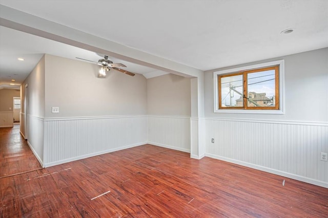 empty room featuring ceiling fan and hardwood / wood-style floors