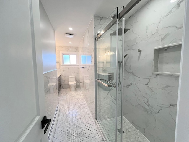 bathroom featuring toilet, walk in shower, and tile walls