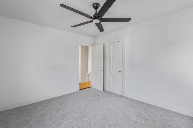 unfurnished room featuring carpet floors and ceiling fan