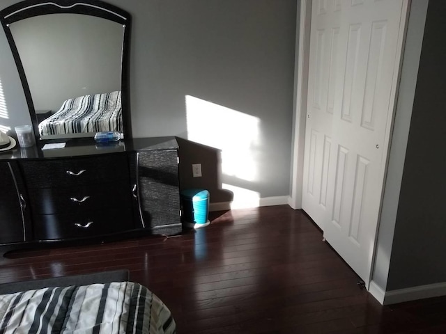 bedroom featuring dark hardwood / wood-style floors