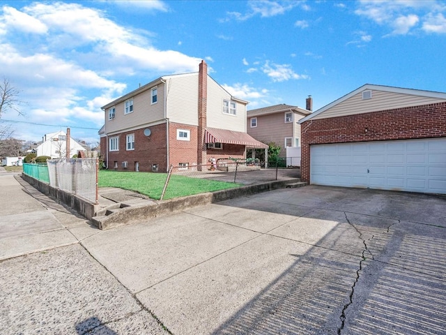 exterior space with a lawn and a garage