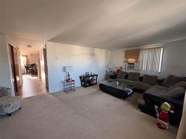 living room featuring cooling unit and light colored carpet