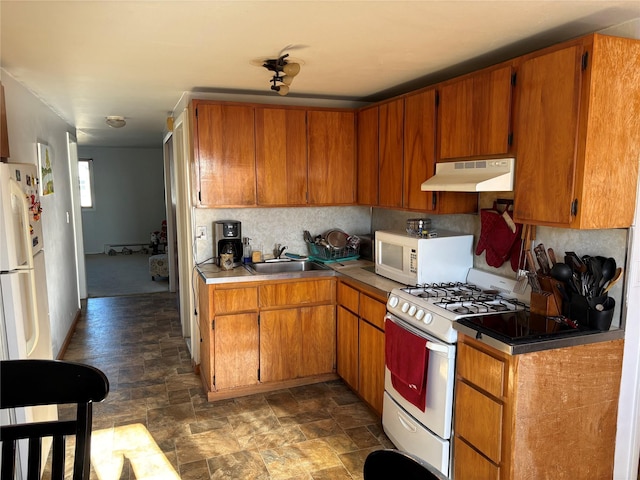 kitchen with white appliances and sink