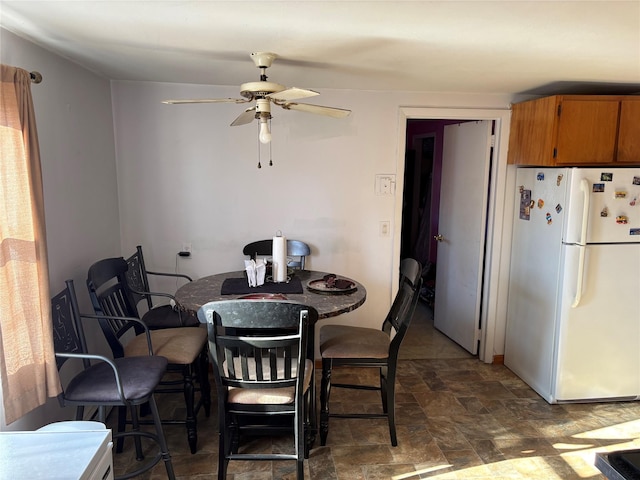 dining room with ceiling fan