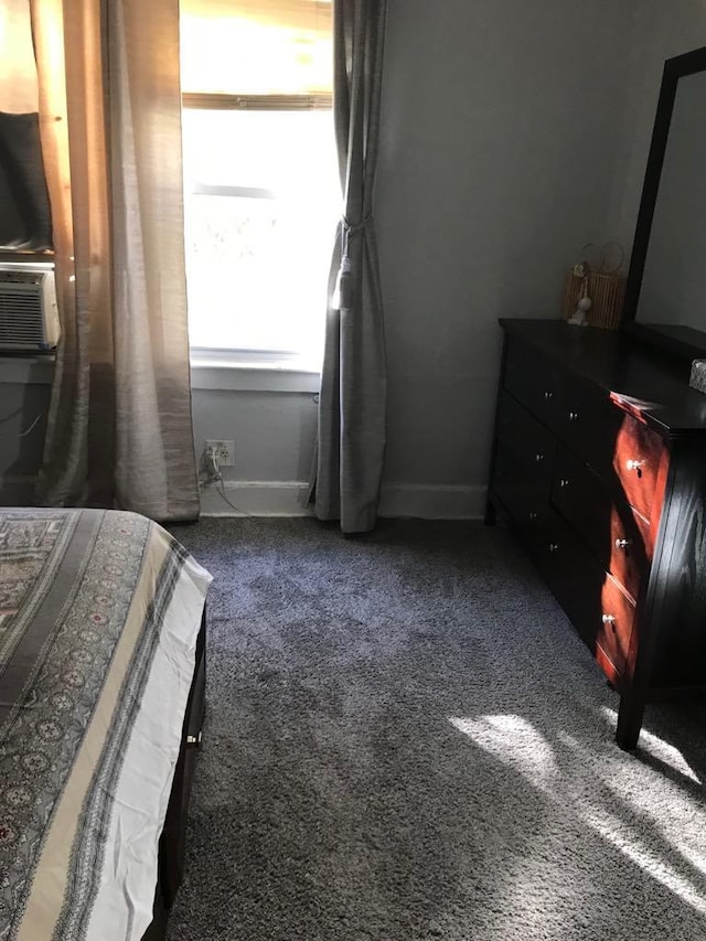 bedroom featuring dark colored carpet