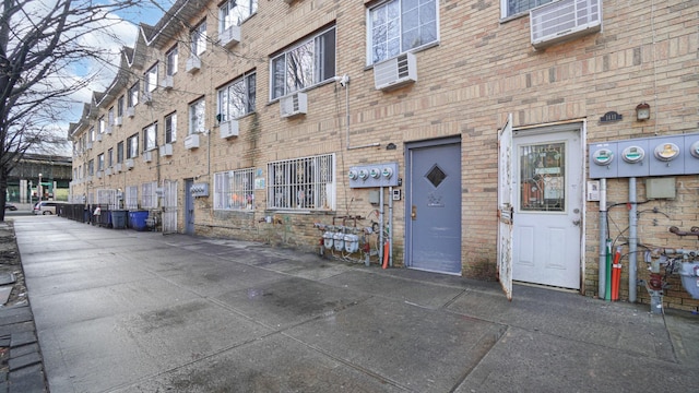 view of property featuring an AC wall unit