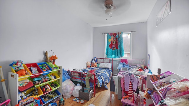 bedroom featuring ceiling fan and hardwood / wood-style floors