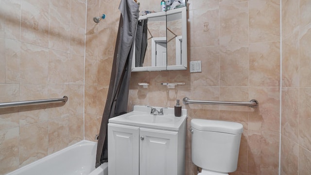 full bathroom featuring shower / bath combo, toilet, tile walls, and vanity