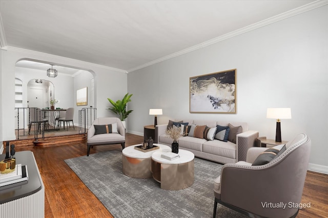 living room with dark hardwood / wood-style floors and crown molding