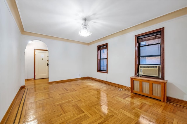 spare room with light parquet floors and cooling unit