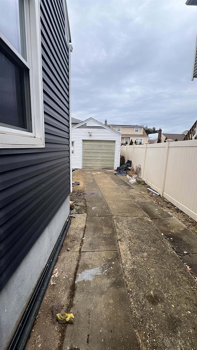 view of side of home with an outbuilding and a garage