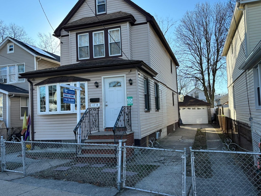 view of front facade featuring an outdoor structure and a garage