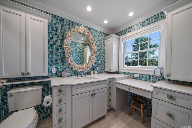 bathroom featuring toilet, tasteful backsplash, tile walls, crown molding, and vanity