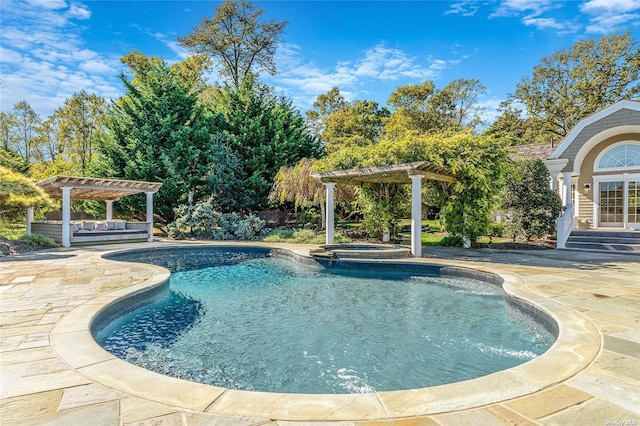 view of swimming pool featuring an outdoor hangout area, a pergola, a patio area, and an in ground hot tub