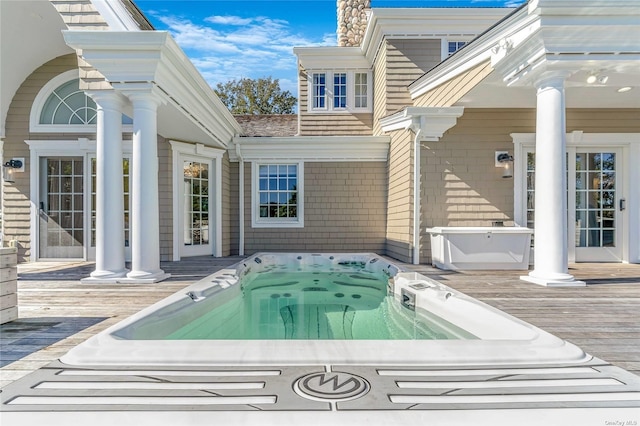 view of swimming pool featuring a wooden deck