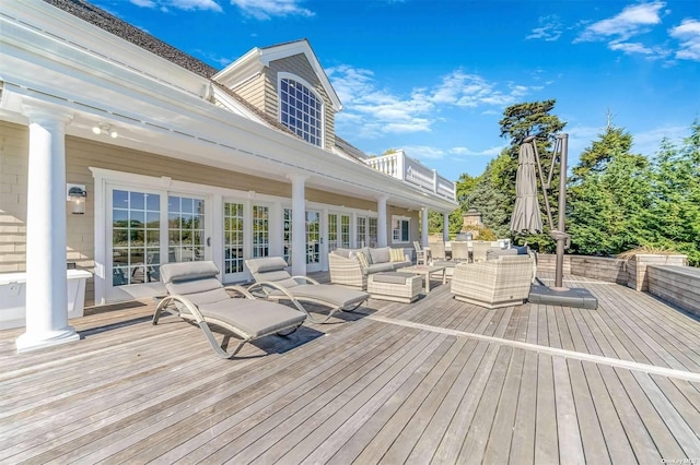 deck featuring an outdoor hangout area and french doors