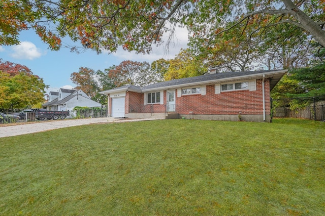 single story home with a garage and a front lawn