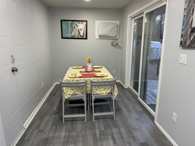 dining area with dark hardwood / wood-style floors