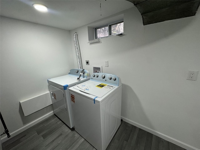 laundry room featuring washing machine and dryer and dark wood-type flooring