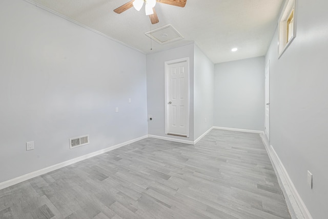 spare room with ceiling fan and light hardwood / wood-style flooring