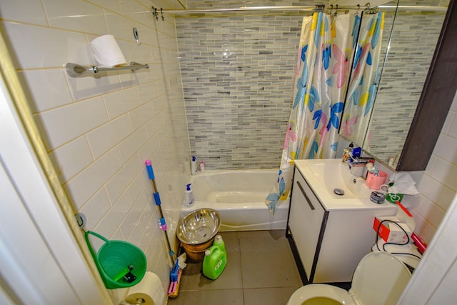 bathroom featuring tile patterned flooring, vanity, and shower / bath combination with curtain