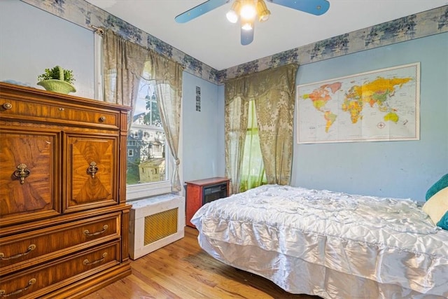 bedroom featuring ceiling fan and light wood-type flooring